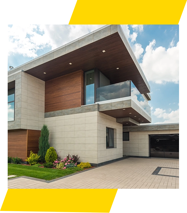 A large modern house with a balcony and a garage.